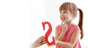 A little girl receiving speech therapy